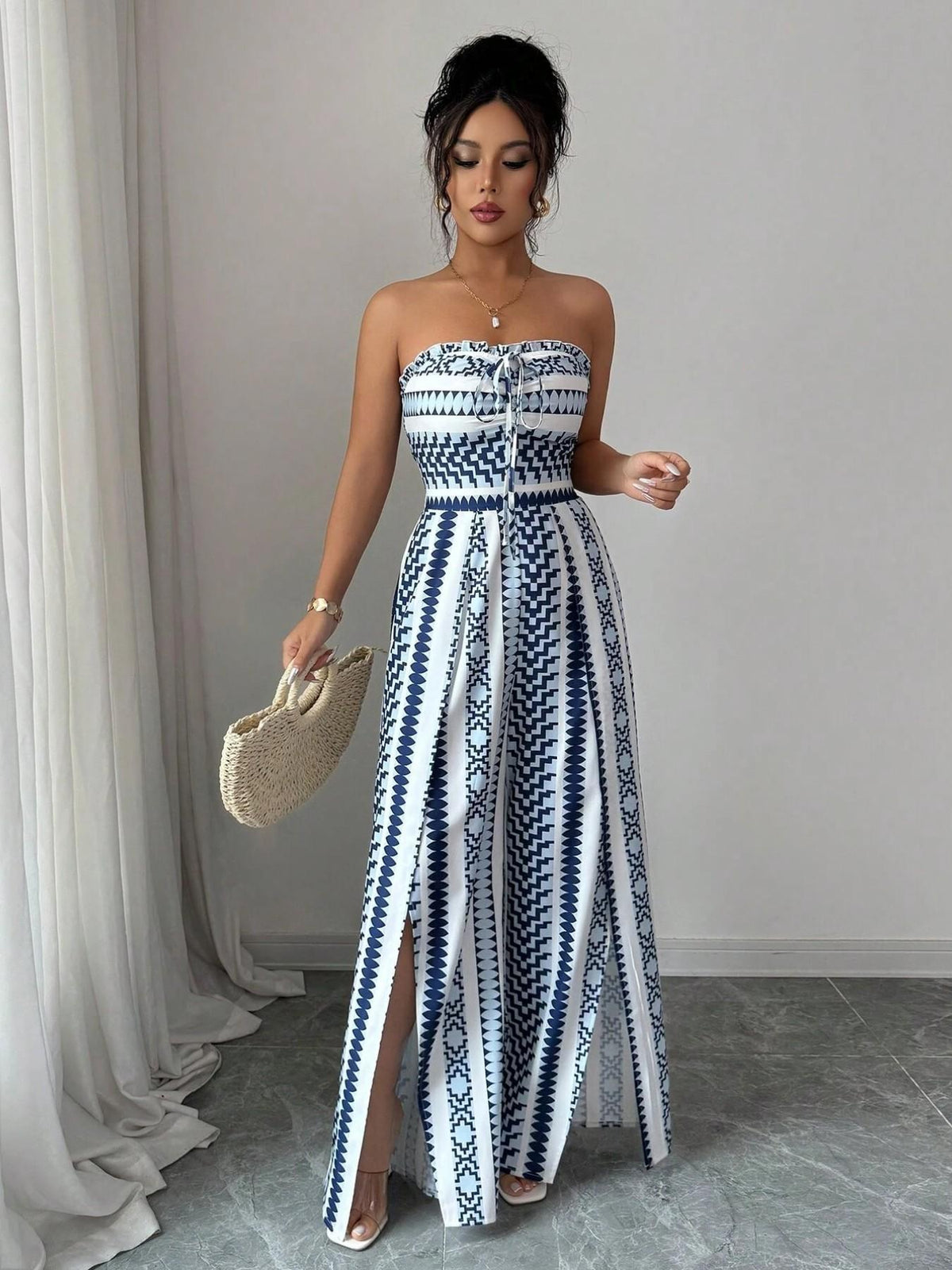 👗 50% OFF NOW! 💥 Geometric Jumpsuit with Halter Neckline & Side Slit – Unique print & elastic back – Versatile, perfect for summer parties or resort wear ✨