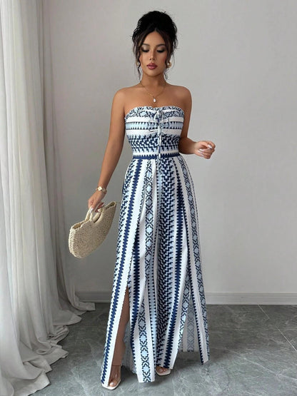 👗 50% OFF NOW! 💥 Geometric Jumpsuit with Halter Neckline & Side Slit – Unique print & elastic back – Versatile, perfect for summer parties or resort wear ✨